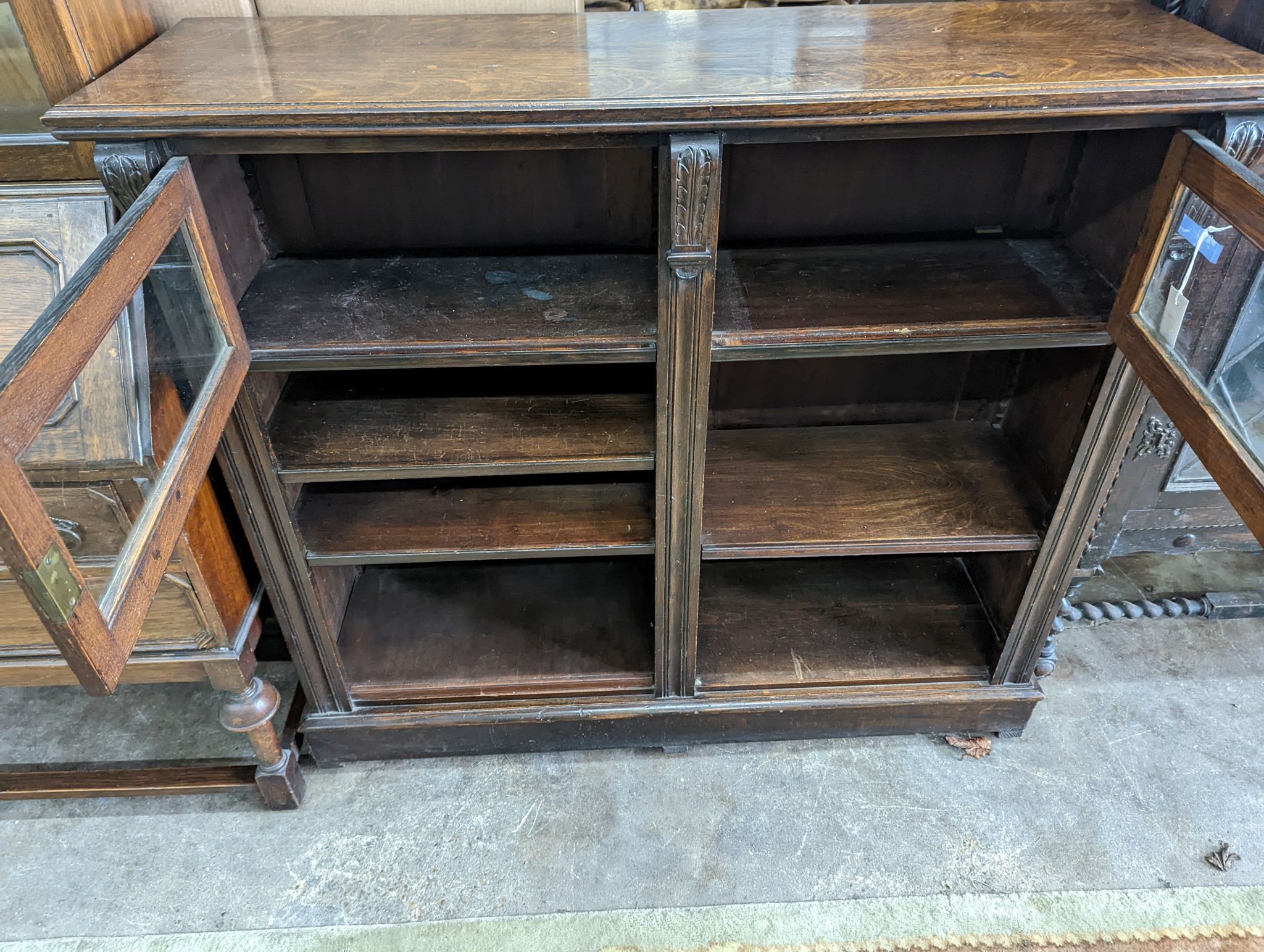 A late Victorian glazed oak bookcase, length 124cm, depth 38cm, height 112cm